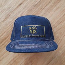 Load image into Gallery viewer, Full denim truckers cap with gold SJS &quot;planer&quot; logo on front panel
